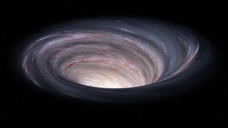 La imagen de un posible agujero negro que estaría en el espacio.