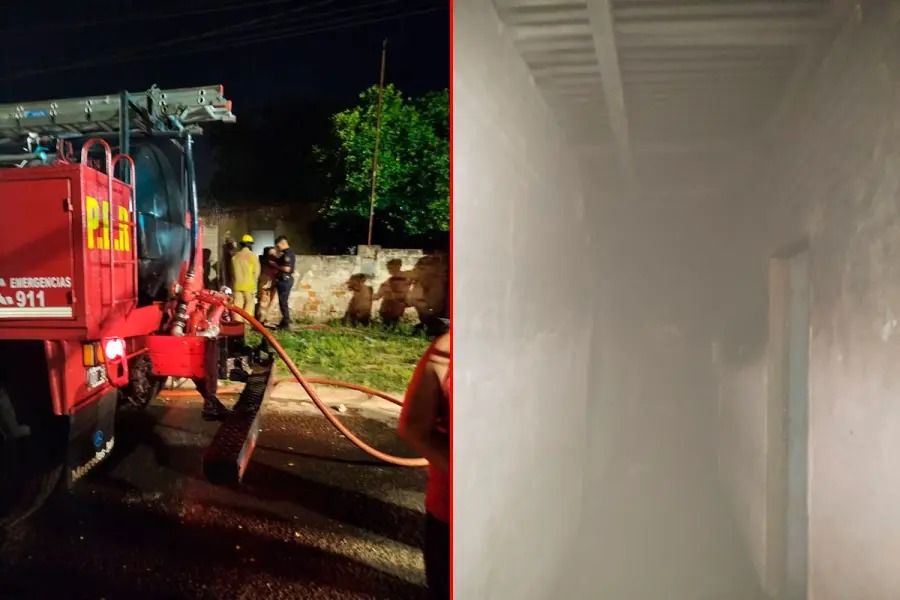 El trabajo de Bomberos Voluntarios de Paran&aacute; para disipar el humo dentro de la vivienda. Foto: Bomberos.